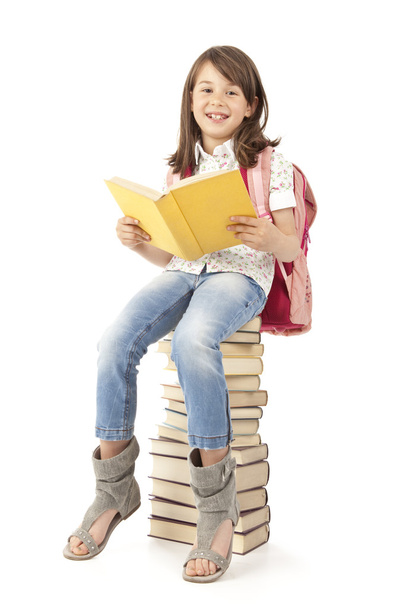 schoolmeisje met boek rugzak - Foto, afbeelding