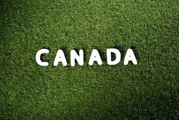 ylhäältä sana 'Kanada' vihreällä ruoho tausta
 - Valokuva, kuva