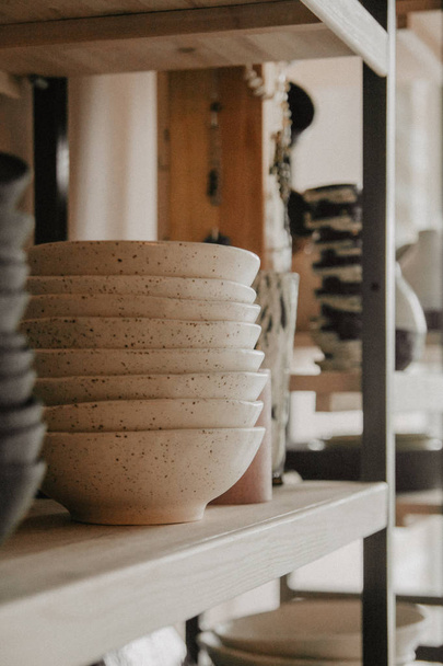 Stack of ceramic plates on cozy background - Foto, Bild