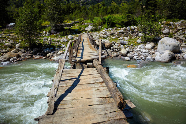 Bridge over river in Himalayas - Фото, изображение