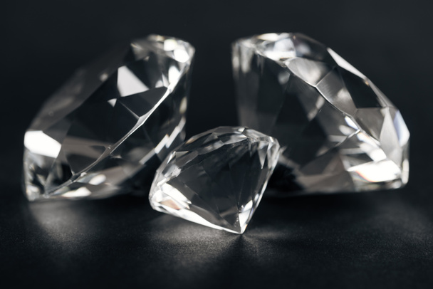 selective focus of clear diamonds on black background  - Фото, зображення