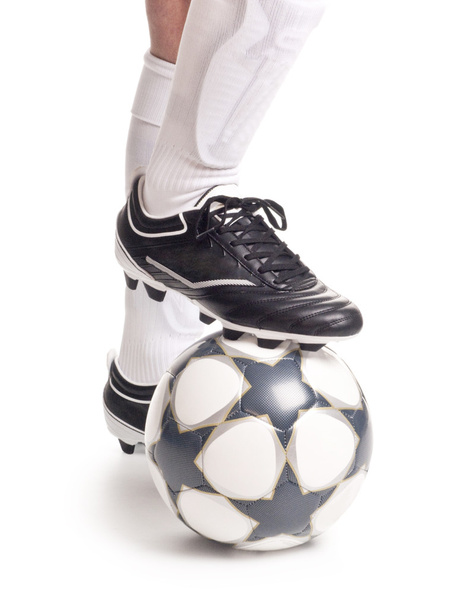 A close up of a soccer ball and shoes - Фото, зображення