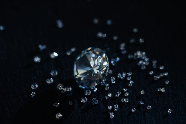 big and small clear diamonds isolated on black - Foto, imagen