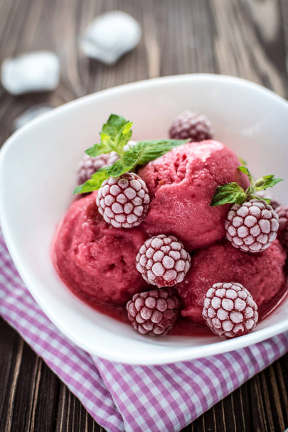 Homemade delicious ice cream  made from fresh berries on a wooden background - Photo, Image