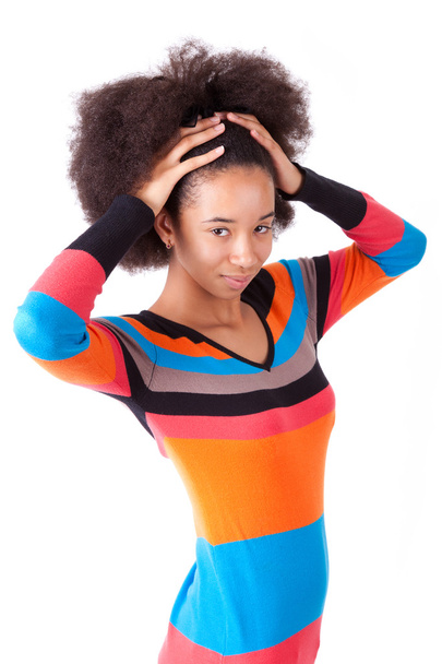 Black African American teenage girl holding her afro hair - Fotó, kép