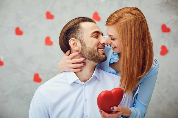 Happy couple with red heart. Valentines day. - Φωτογραφία, εικόνα