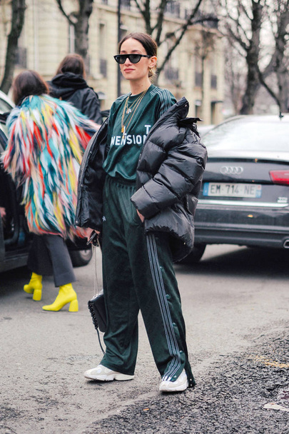 A trendy pedestrian walks on the street during the Paris Fashion Week Fall/Winter 2018 in Paris, France. - Фото, зображення