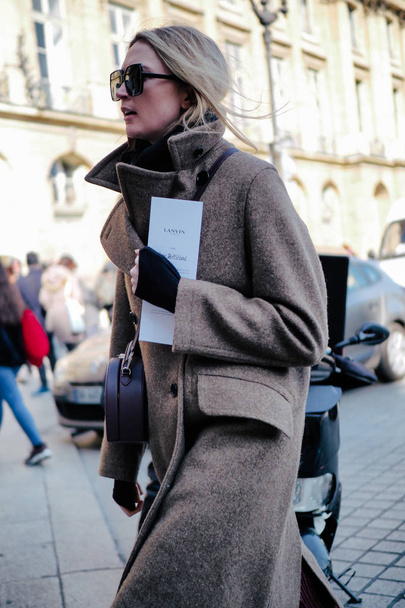 A trendy pedestrian walks on the street during the Paris Fashion Week Fall / Winter 2018 in Paris, France
. - Фото, изображение