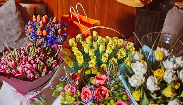 Many bouquets and paper flowers with chocolates inside - Photo, image