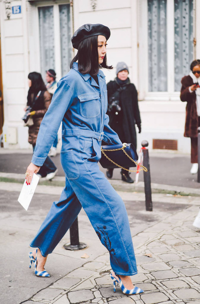 A trendy pedestrian walks on the street during the Paris Fashion Week Fall/Winter 2018 in Paris, France. - Photo, Image
