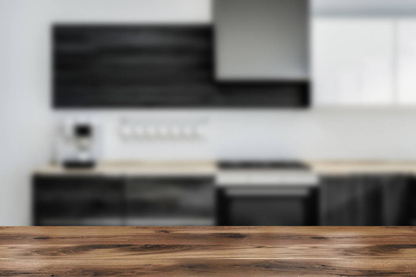 Interior of modern kitchen with white walls, wooden floor, wooden countertops with built in cooker and coffee machine. 3d rendering blurred - Valokuva, kuva