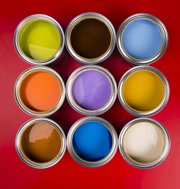 Paint cans color palette, red background - Photo, Image