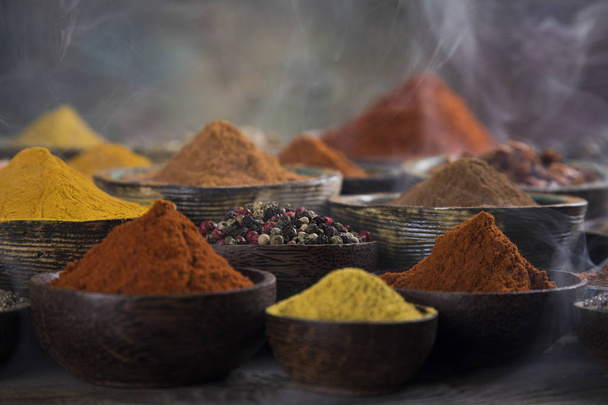 Variety of spices and herbs on kitchen table - Photo, Image
