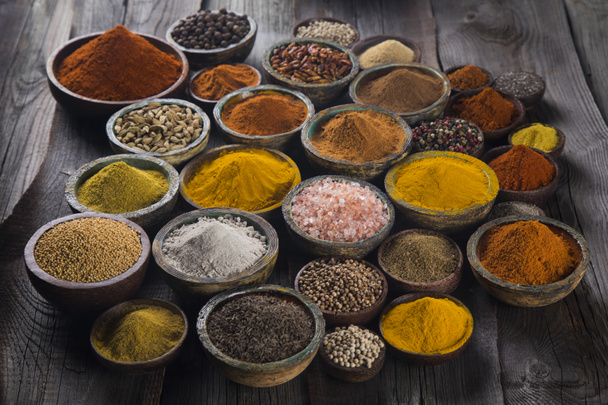 Variety of spices and herbs on kitchen table - Photo, Image