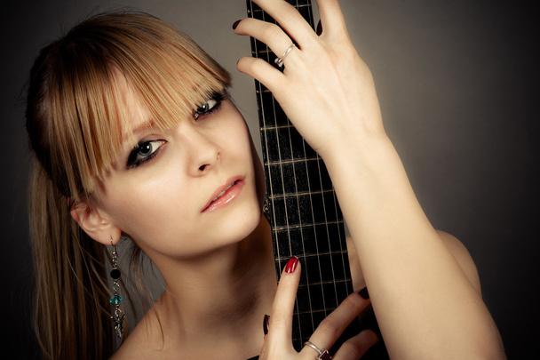 girl with a guitar fretboard - Photo, Image
