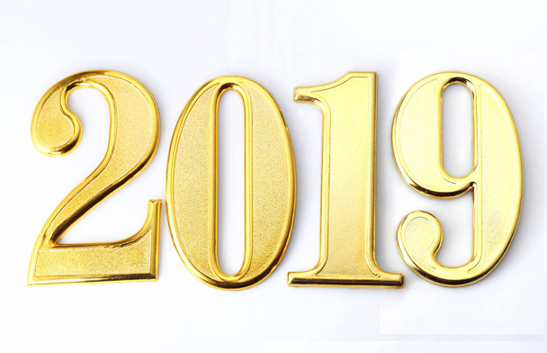 2019 gold numbers text on white background - Fotoğraf, Görsel