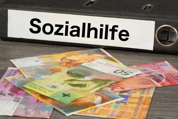 Banknotes Swiss francs and social assistance in Switzerland - Photo, Image