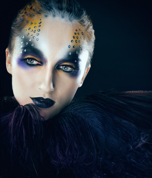 Cre ative face paint portrait.Young beautiful fashion model with creative makeup close-up portrait - Фото, зображення