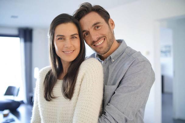  Portrait of gorgeous couple embracing at home                               - Photo, image