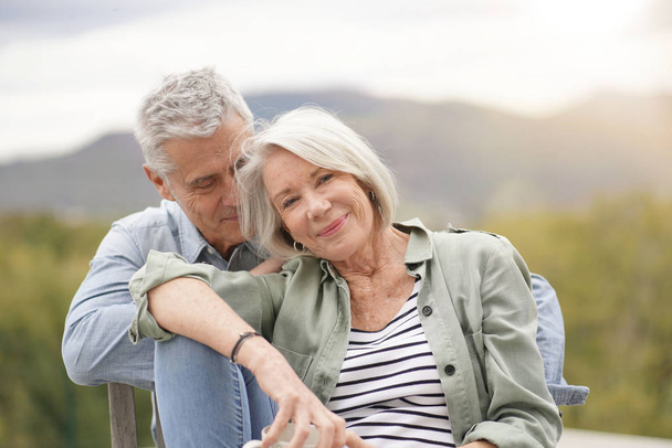 Loving portrait of modern senior couple outdoors                             - Foto, Imagem