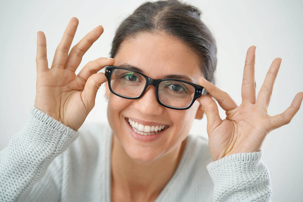 Isolated portrait of smiling attractive brunette in glasses - Fotografie, Obrázek