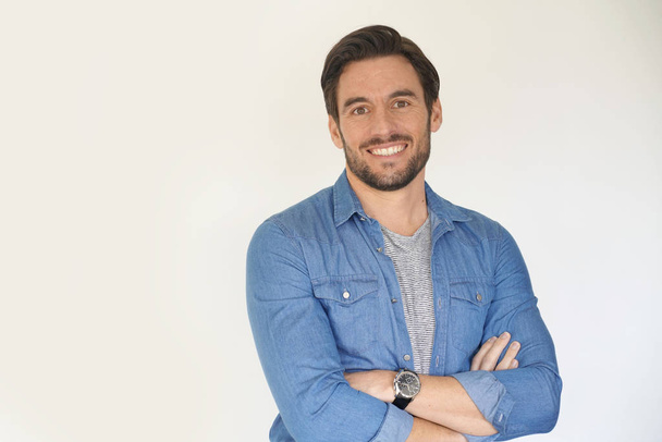 Very handsome casual man smiling and standing on white background - Zdjęcie, obraz