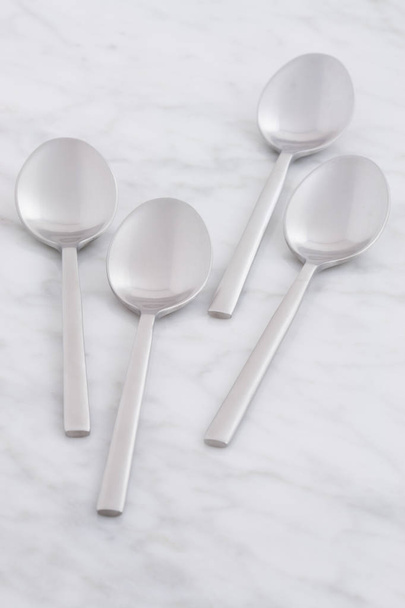 silver spoon set styled on antique carrara marble - Photo, Image