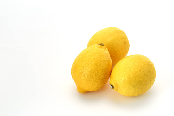 Three ripe lemons isolated on White Background, empty space - Foto, Imagem