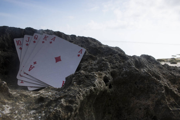 diamante royal flush poker card gamble praia tema
 - Foto, Imagem
