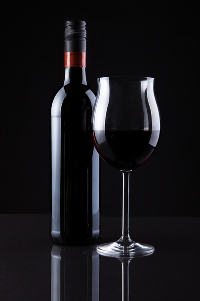 Bottle Of Wine And Glass Isolated On Black Background - Photo, Image