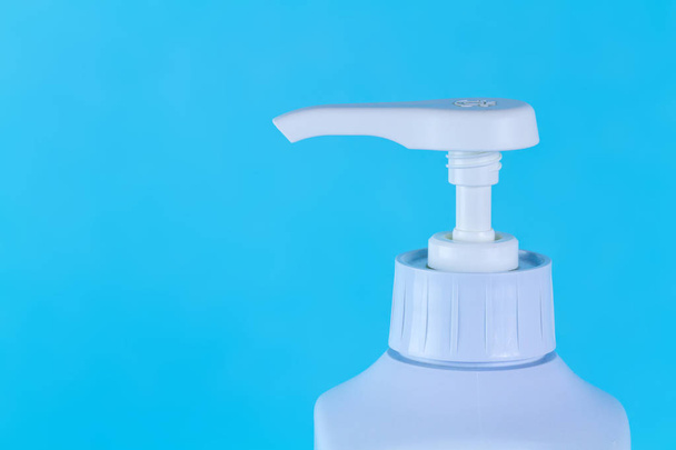 Dishwashing liquid on a blue background. Copy space  - Фото, зображення