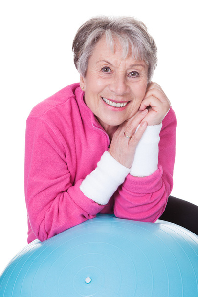 Senior Woman Leaning On Pilates Ball - Photo, image
