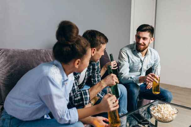young awesome people are laughing while drinking beer - Photo, Image