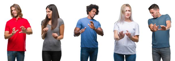 Composition of african american, hispanic and caucasian group of people over isolated white background disgusted expression, displeased and fearful doing disgust face because aversion reaction. With hands raised. Annoying concept. - Photo, Image