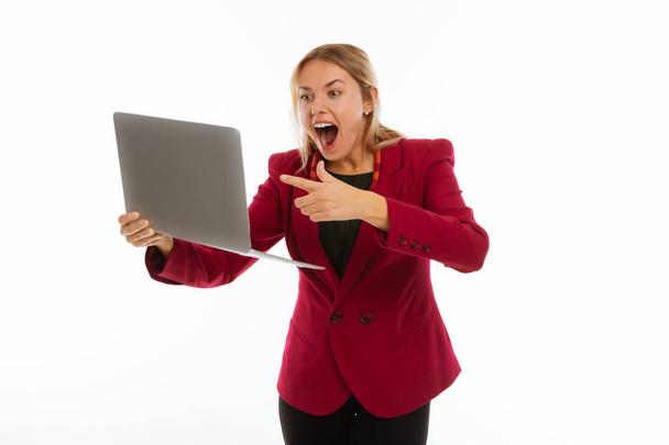 Delighted cheerful businesswoman pointing at the screen - Фото, зображення