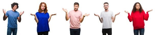 Composition of african american, hispanic and caucasian group of people over isolated white background clueless and confused expression with arms and hands raised. Doubt concept. - Photo, Image