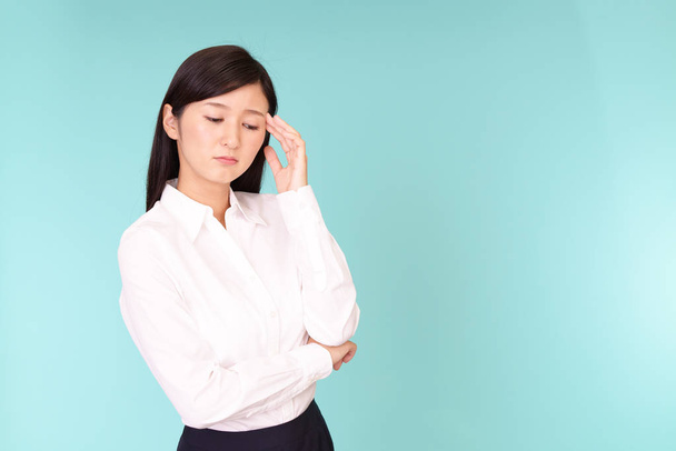 Asian woman is feeling tired and stressed - 写真・画像