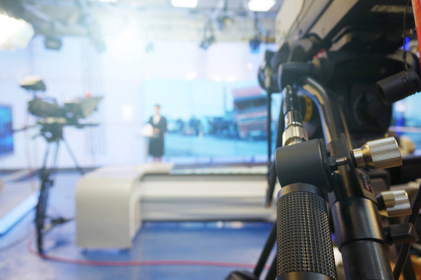 The news presenter reads the text on the teleprompter.Camera in the office. TV studio. - Photo, Image