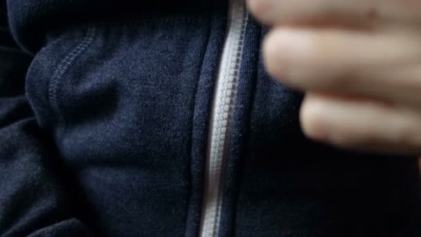 Female hands stretch the hoodie in close-up. - Footage, Video