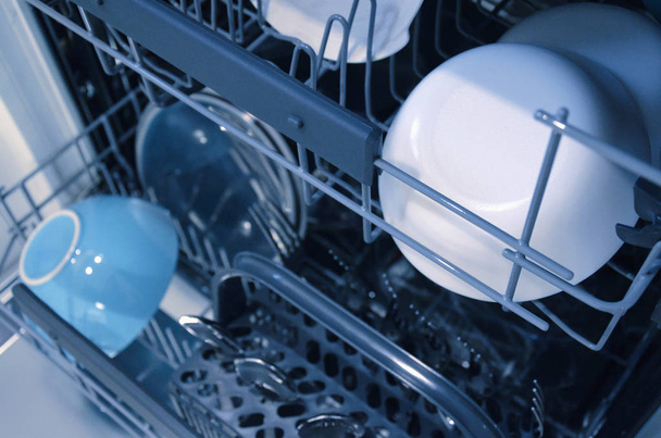 Open dishwasher with clean dishes, selective focus. Image - Foto, immagini