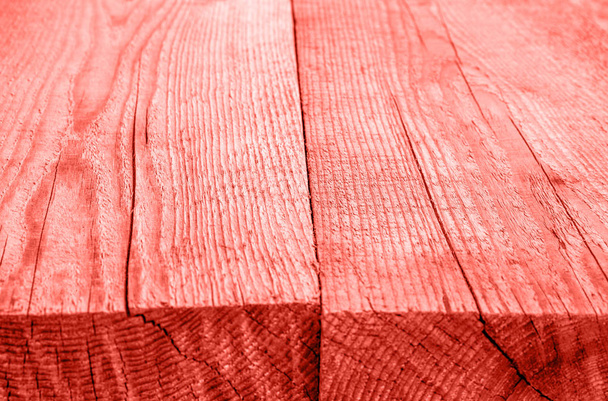 Rough wooden boards, background toning in Living Coral color of the Year 2019 - Fotó, kép