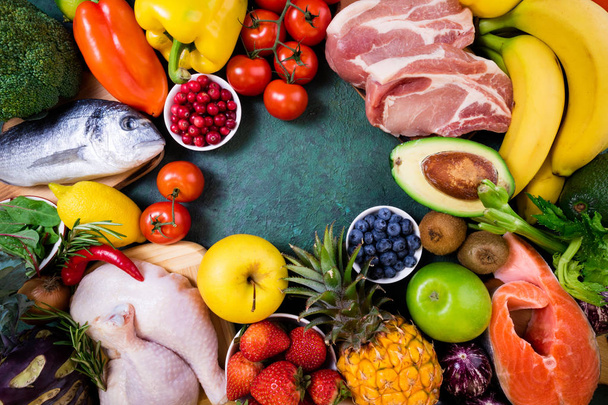 Background healthy food. Fresh fruits, vegetables, meat and fish on table. Healthy food, diet and healthy life concept. Top view, copy spac - Foto, Imagen