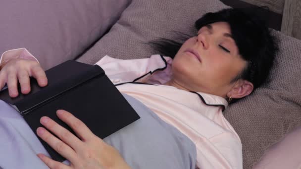 Woman with book try fall asleep - Footage, Video
