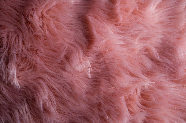 Roze schapenvacht achtergrond. Bont patroon. Wol textuur. Schapen vacht dichtbij u - Foto, afbeelding