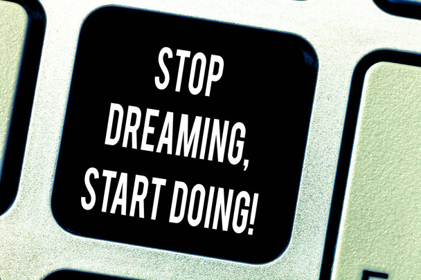 Writing note showing Stop Dreaming Start Doing. Business photo showcasing Put your dreams into action Materialize it Keyboard key Intention to create computer message pressing keypad idea. - Photo, Image