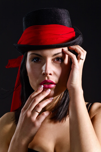 woman in black hat with red scarf - Fotografie, Obrázek