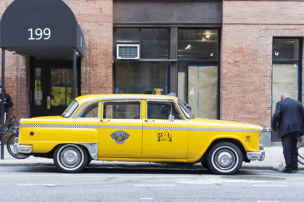 Vintage classic yellow nyc cab in the street - Photo, Image