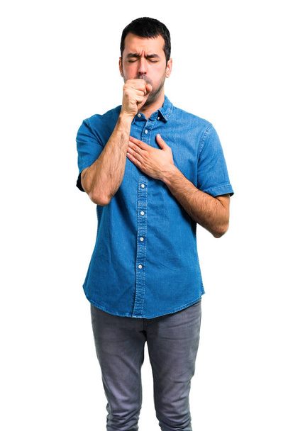 Handsome man with blue shirt is suffering with cough and feeling bad - Foto, afbeelding