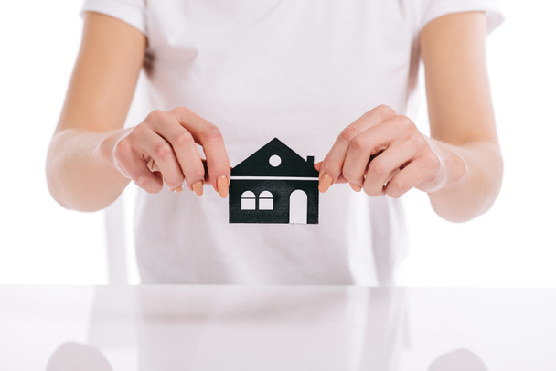 cropped view of woman holding paper house isolated on white, mortgage concept - 写真・画像