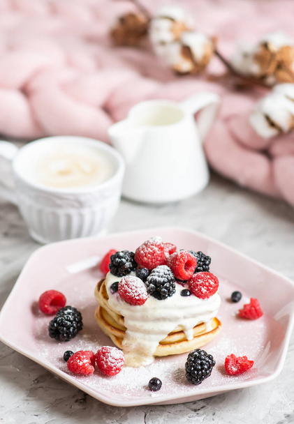Homemade Pancakes Cappuccino Giant Merino Wool Blanket Pastel Pink Plate Sour Cream Berries Coffee Healthy Breakfast Cotton Flower Morning Concept - Φωτογραφία, εικόνα